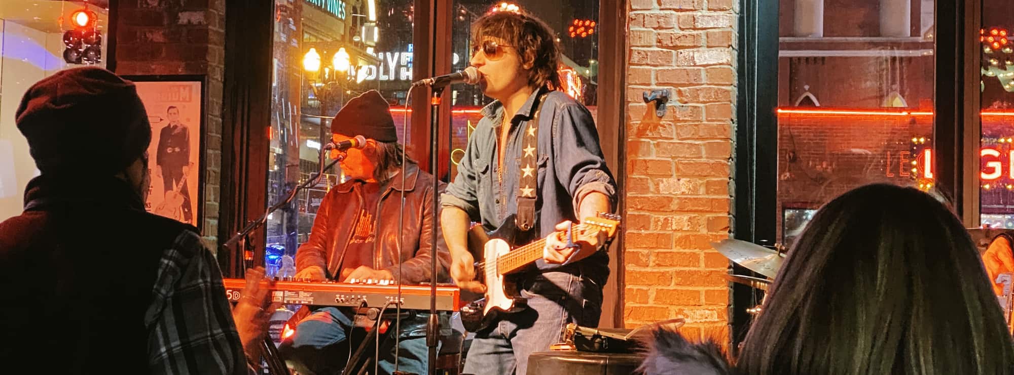 bar singer on guitar in Asheville