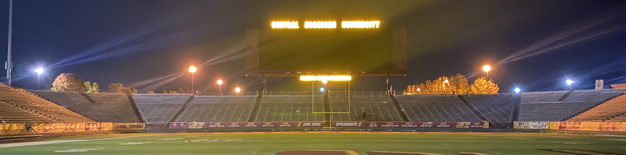 empty football stadium at night under the lights Asheville